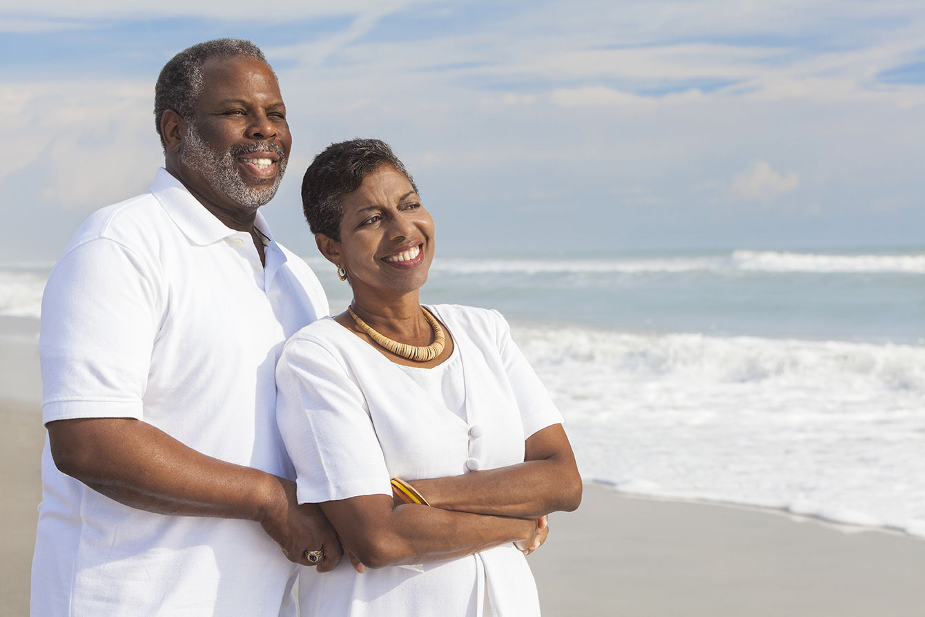 Happy senior african american couple on beach