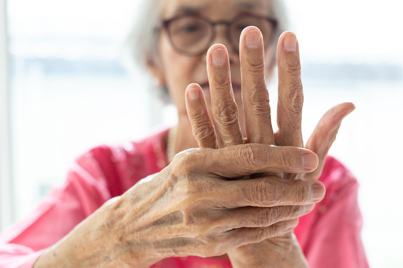 Elderly woman suffering from arthritis pain in her hand