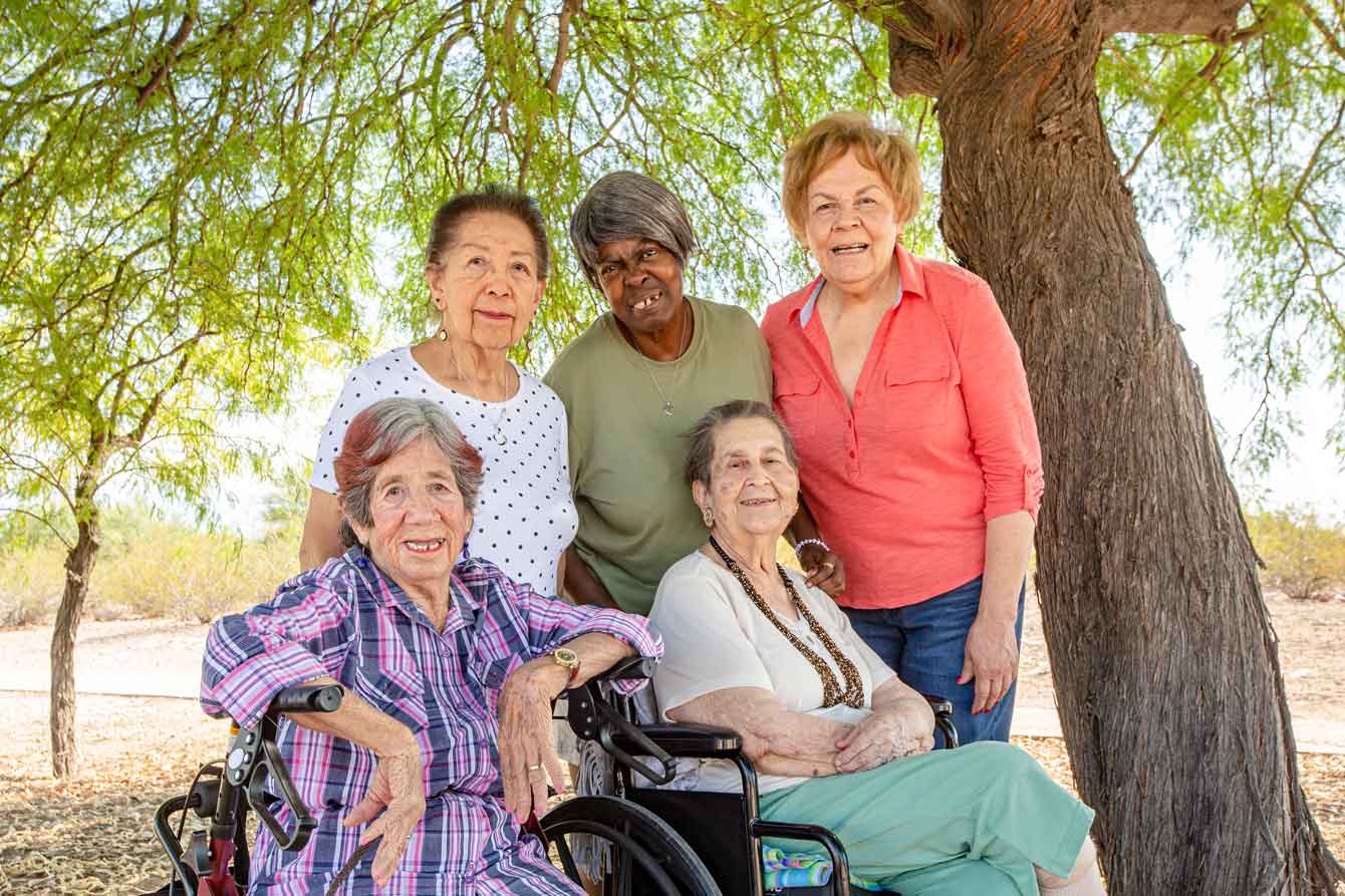 A group of disabled women in the park on a sunny day
