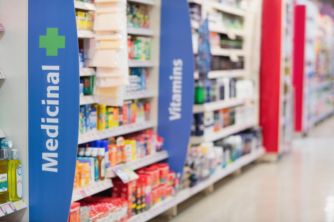 Side view of medicine aisle in grocery store