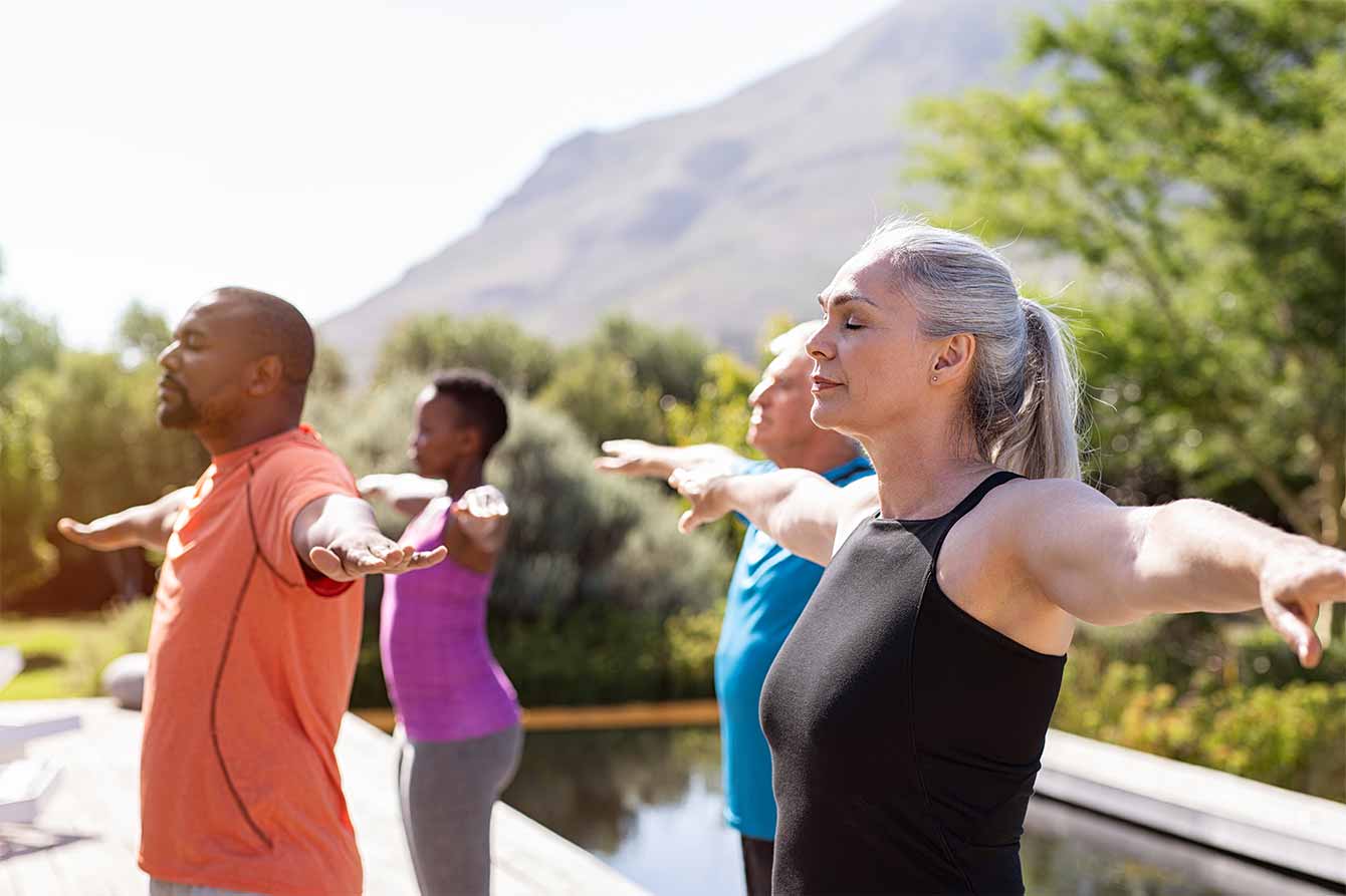 A group of seniors practice yoga