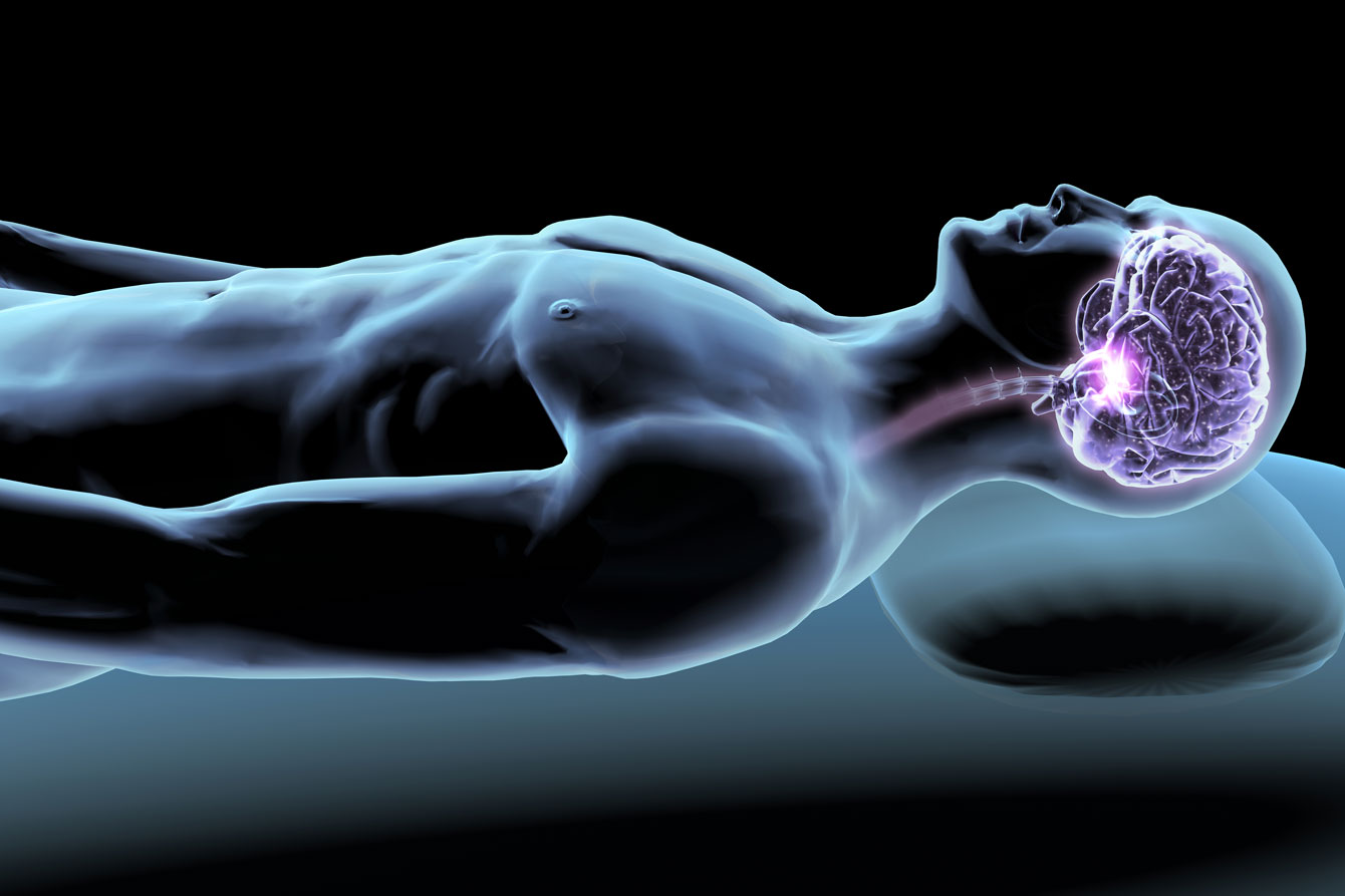 X-ray of a sleeping man with a purple fluroscent brain