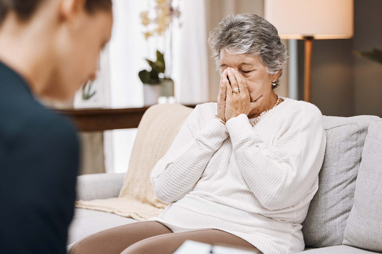 senior woman looks hopeless during eviction consultation