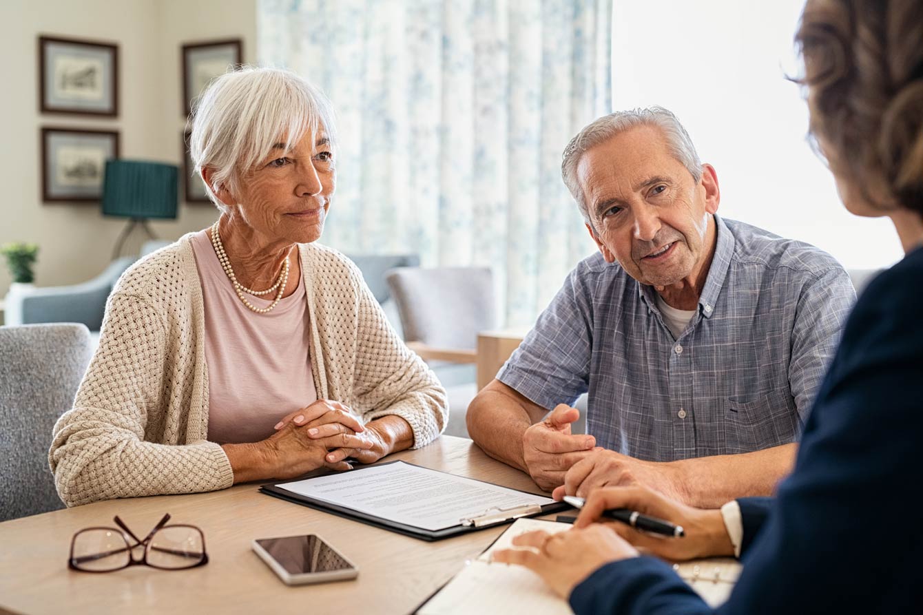 senior couple discussing their in-home senior care options