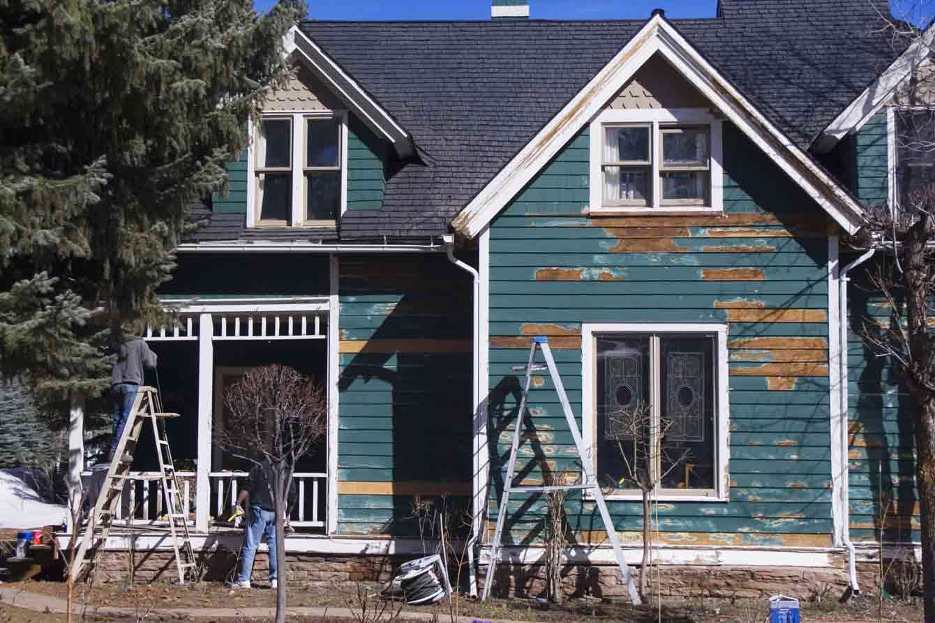 An older, dilapidated house being repaired