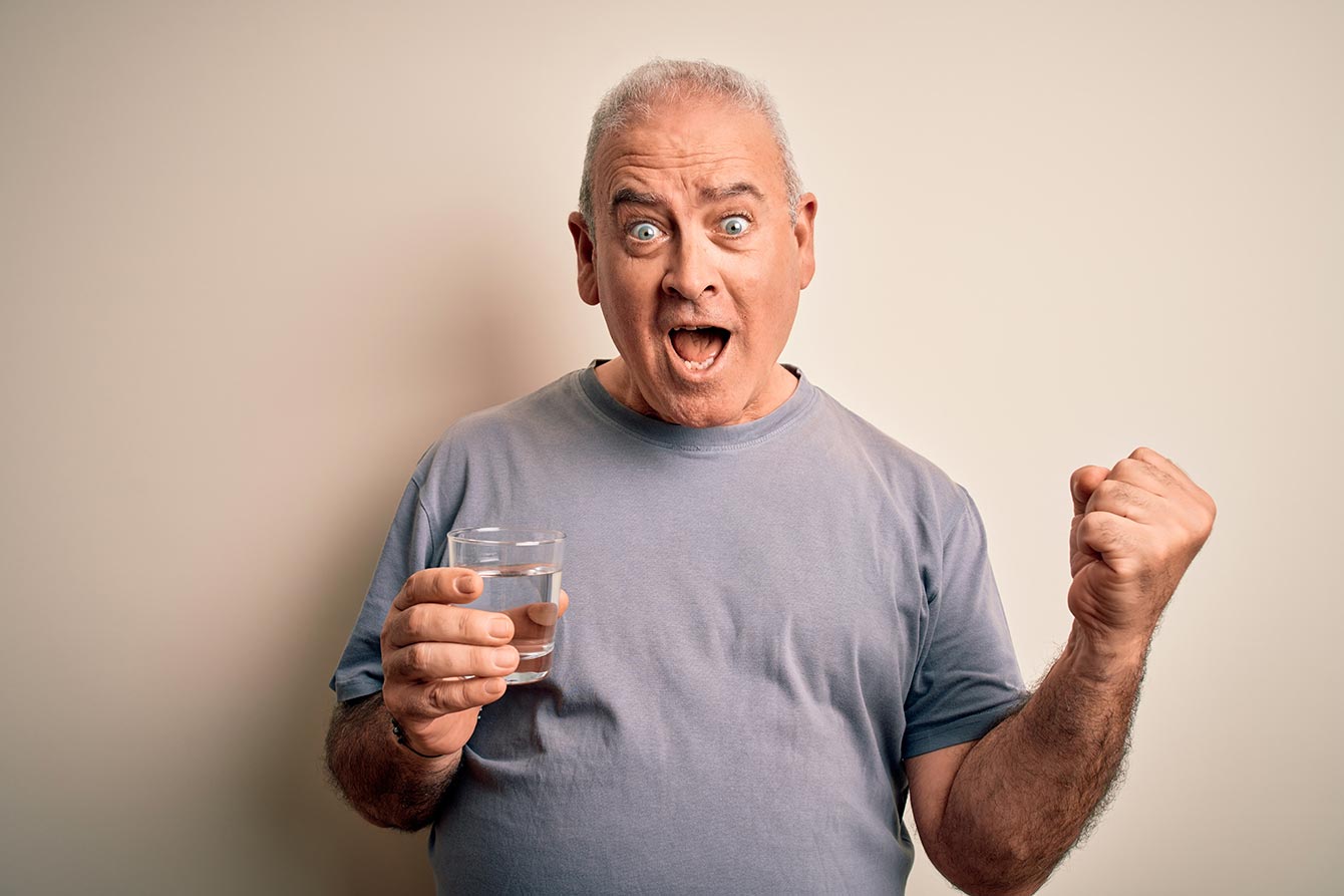 Senior man excited to drink water