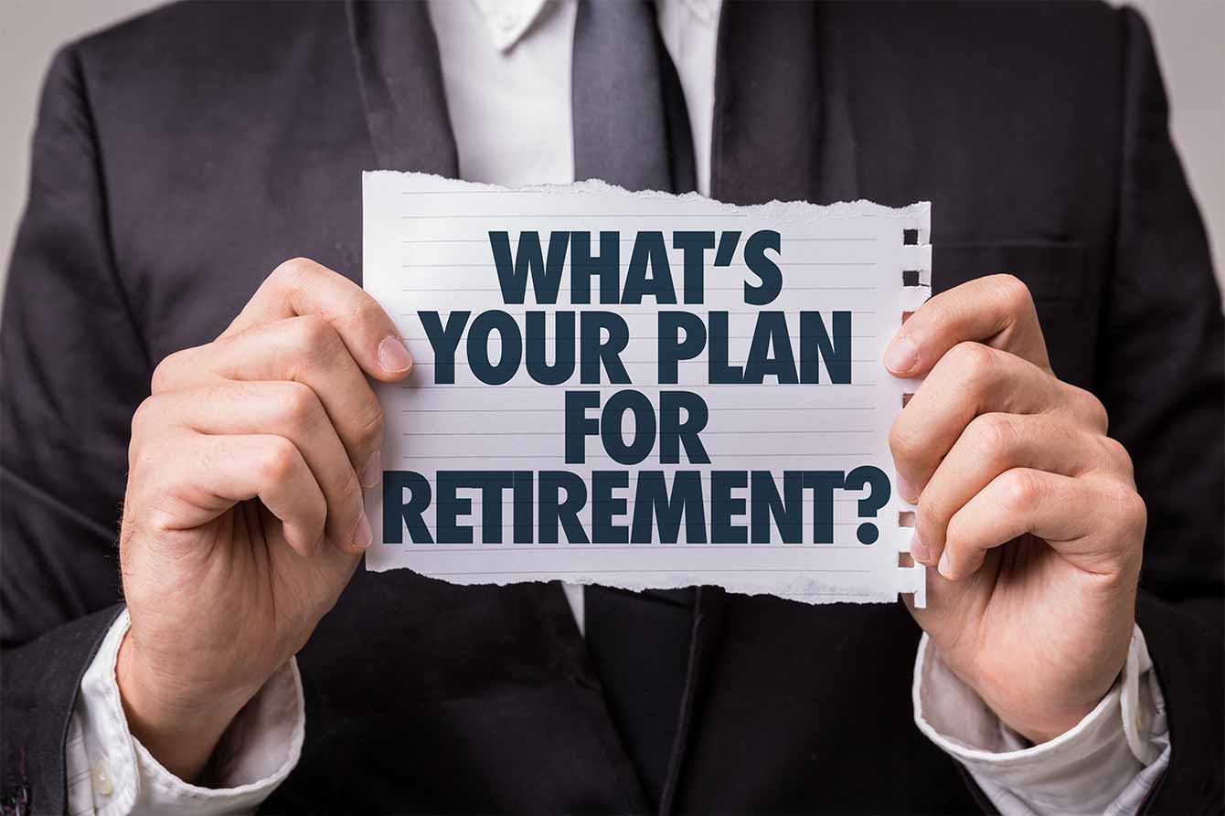 A man in suit holds a ripped piece of paper that reads what is your plan for retirement?