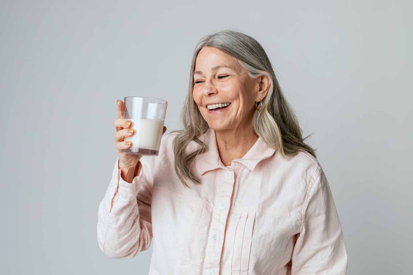 senior woman enjoys her warm nutritional drink