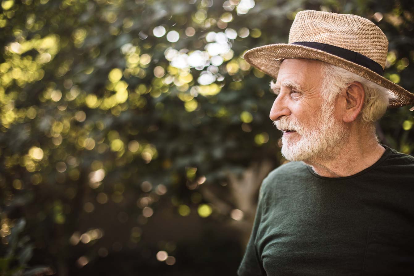 senior man looks far from his farm