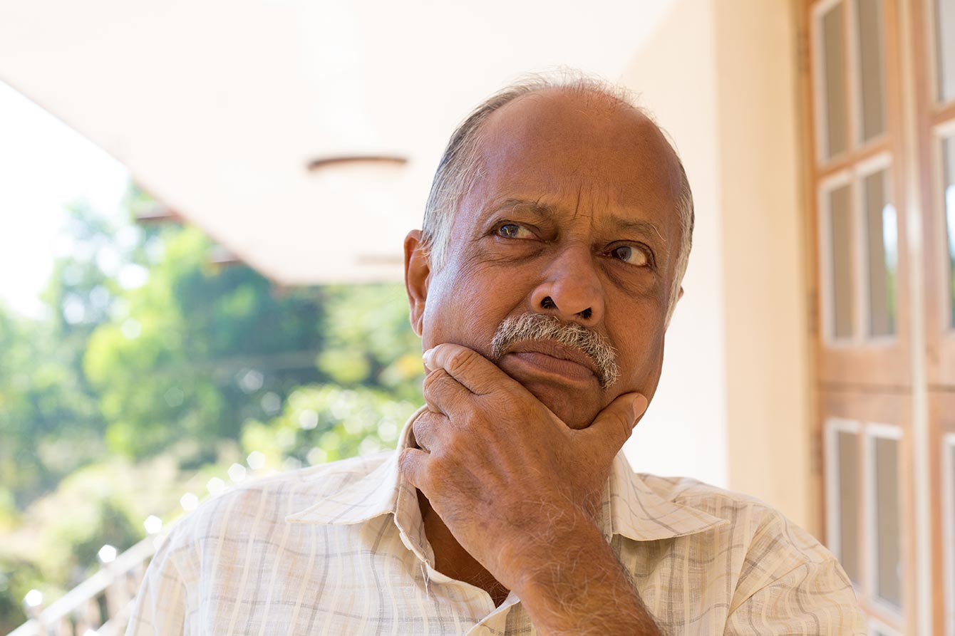 Senior African American man in deep thought