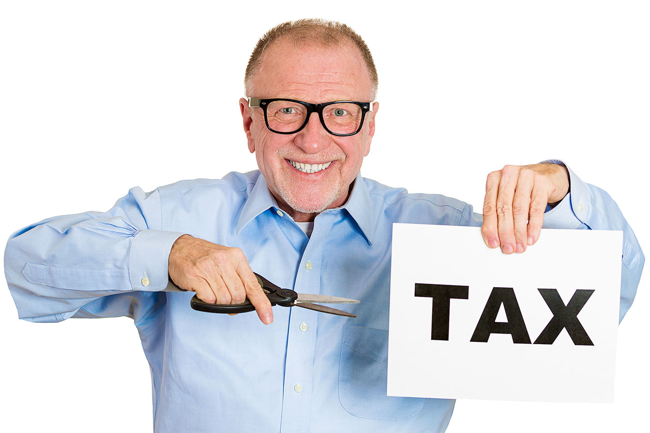 Senior elderly man cutting tax paper on white background