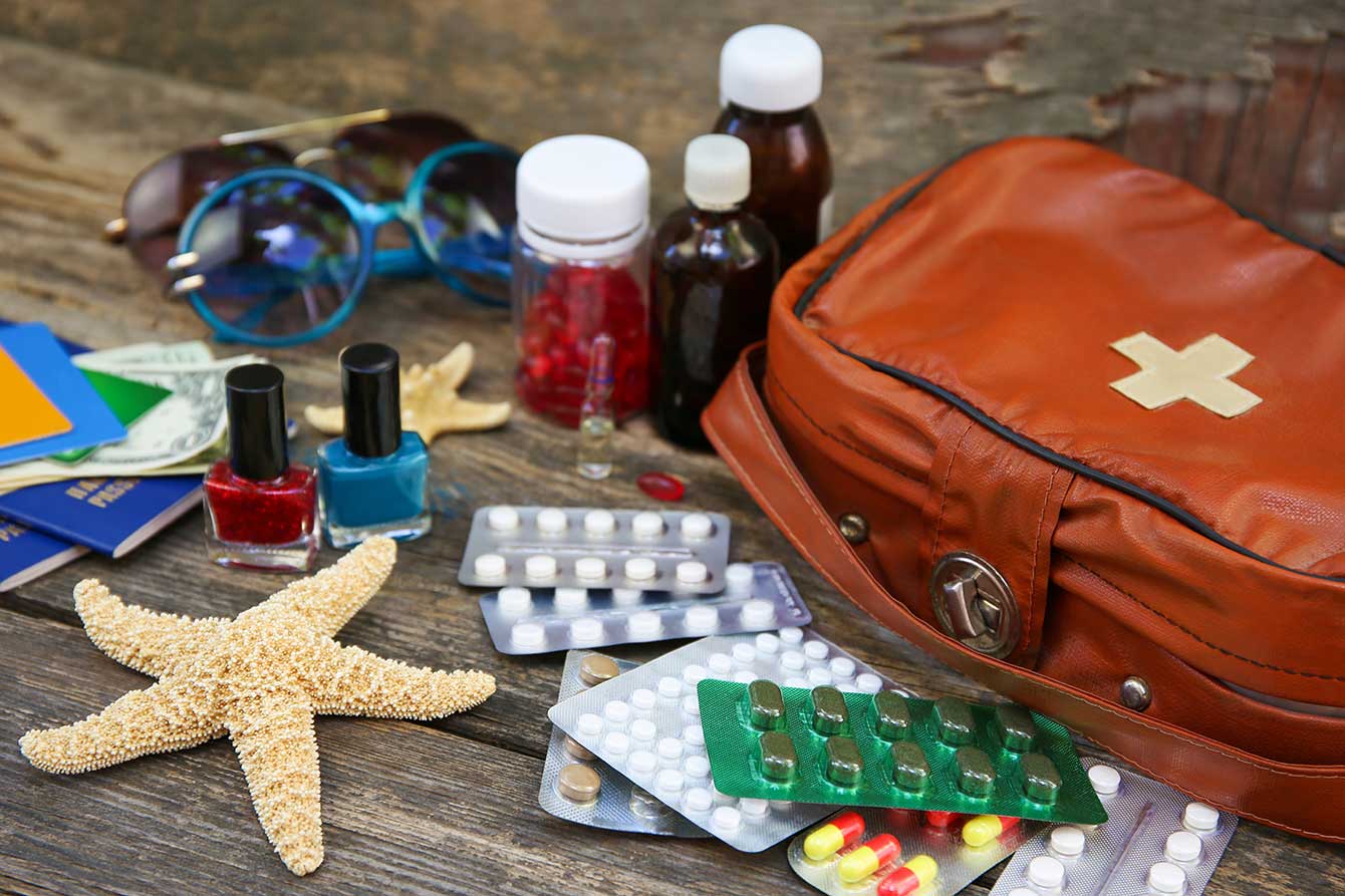 First aid kit on top of beach boardwalk concept