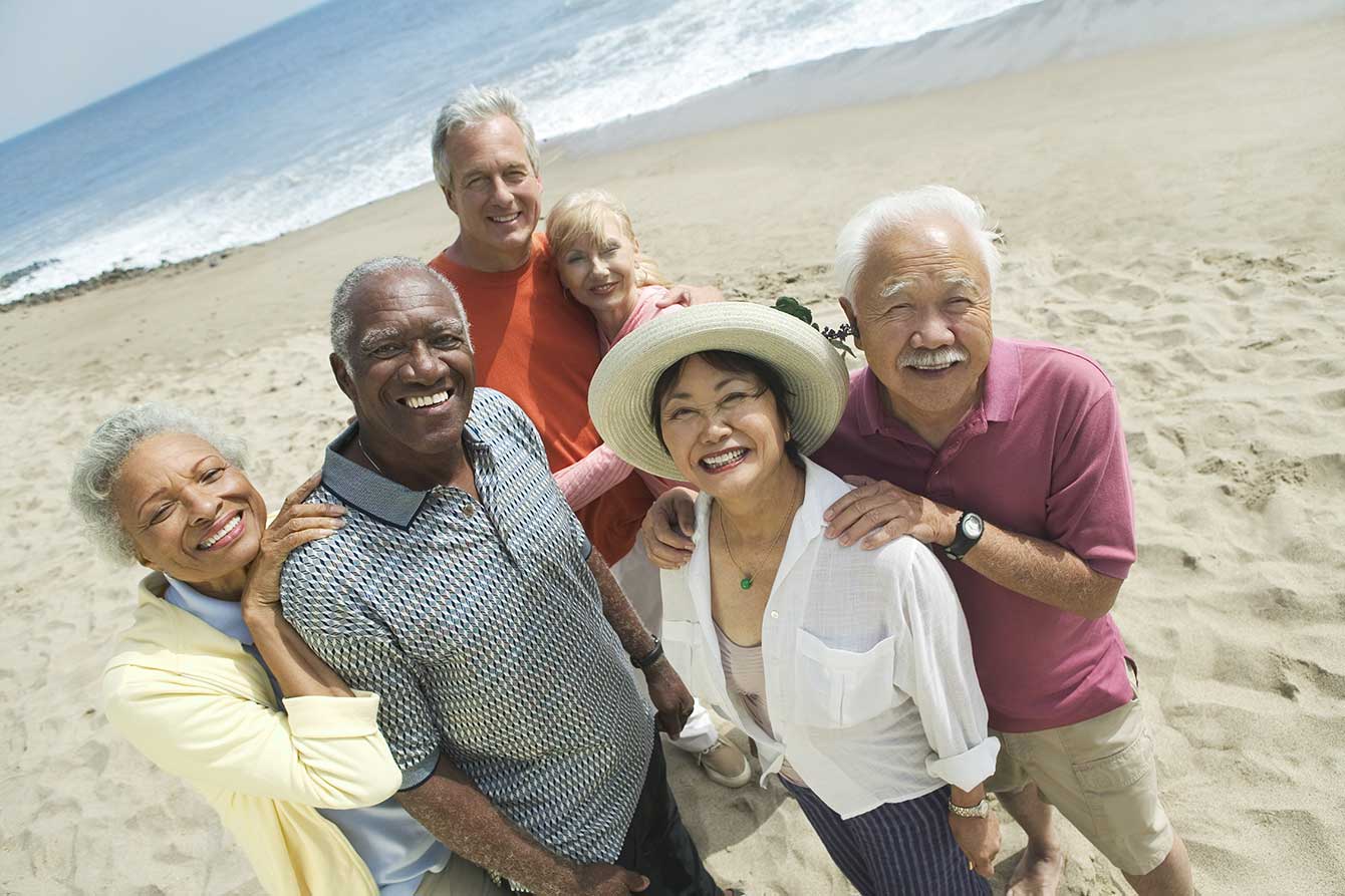 Multi ethnic seniors happy on the beach