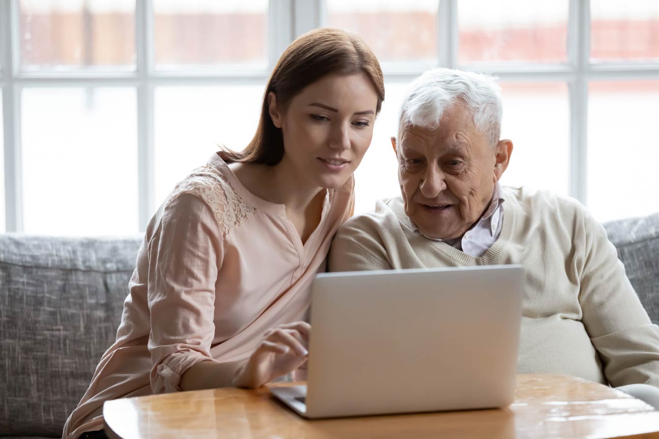 daughter and father choosing home care providers online