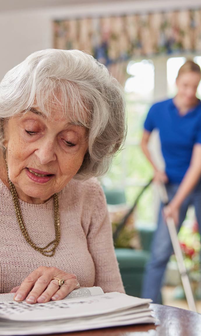 help cleaning house while senior woman does crossword