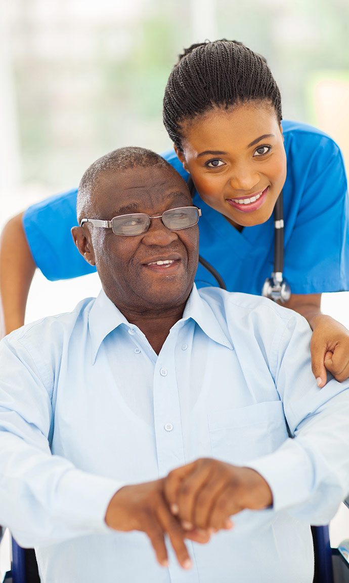 nurse with senior in chair