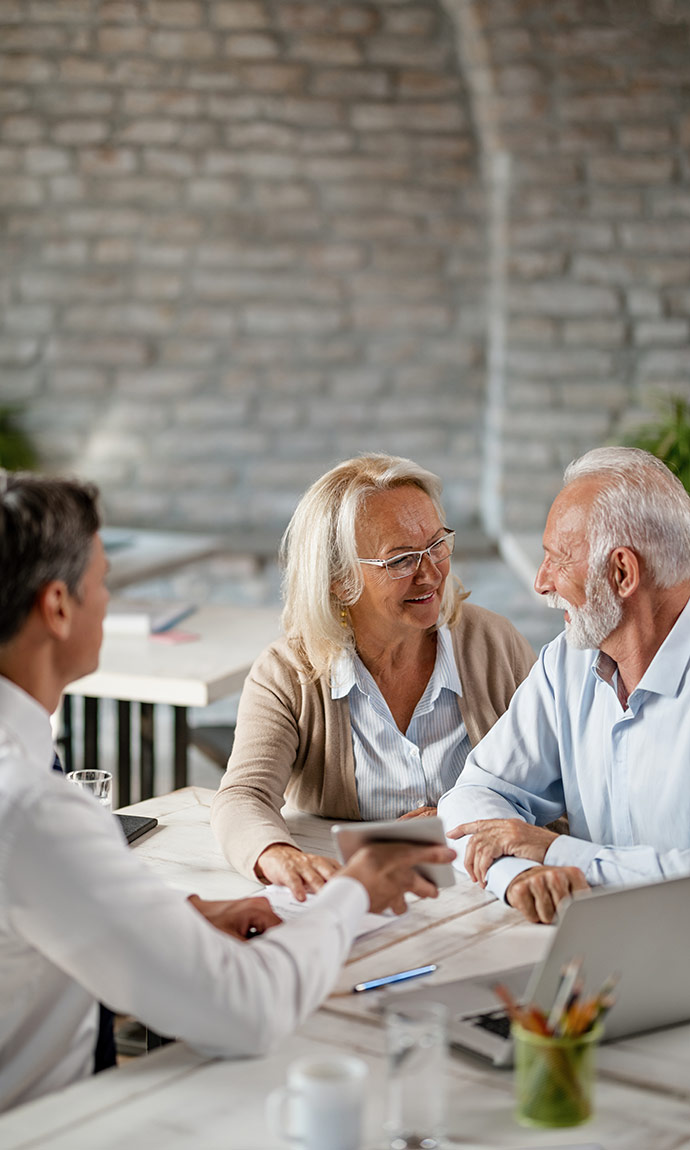 couple talking to insurance agent