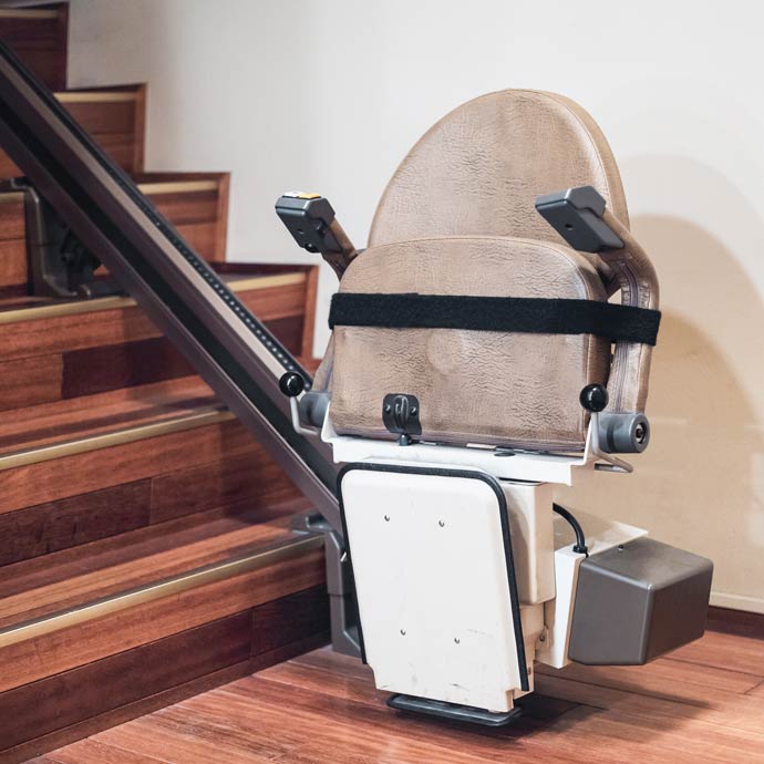 installed wheelchair lift at the bottom of stairs