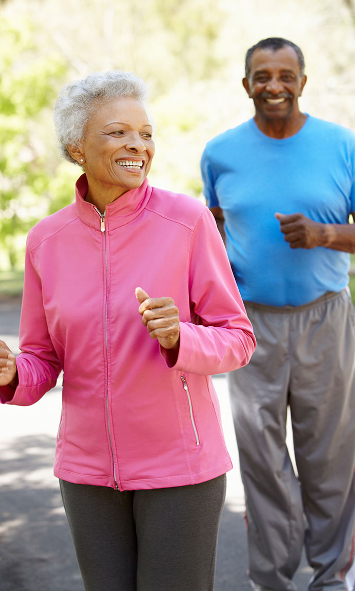 senior couple jogging outside