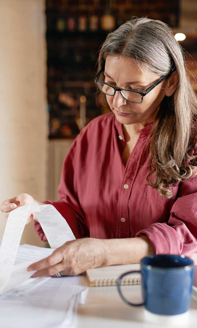 senior lady checking her receipt